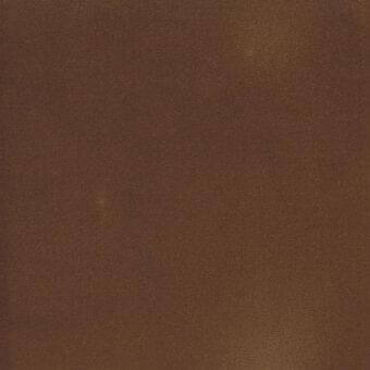 Deep brown velveteen fabric swatch displays a matte finish and directional nap, identified as “s velveteen” with even, diffused lighting.