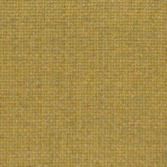 Mustard yellow fabric sample with dense, irregular weave and matte finish; heathered texture shows horizontal and vertical thread intersections.