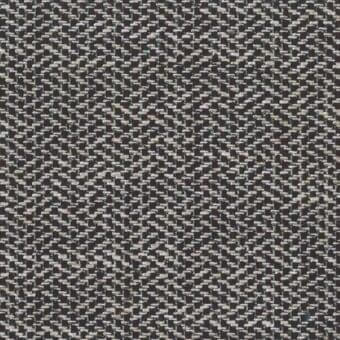 Woven fabric sample, brown and beige tones, dense irregular weave with subtle gray highlights and a slightly nubby texture.