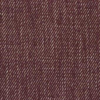 Burgundy fabric sample with diagonal dot texture, woven appearance, and cream-colored raised dots; studio shot displaying material quality.