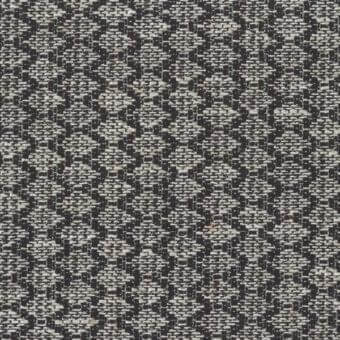 Mariani Syros fabric sample, charcoal gray and off-white geometric weave, textured with repeating diamond and chevron motifs.