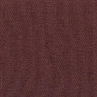 Reddish-brown fabric sample with dense, granular texture and scattered beige flecks, exhibiting a matte finish and subtle tonal variations.
