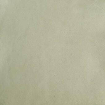 Pale green leather texture, full-grain hide, consistent color, diffused lighting, Mariani leather sample, pa antares atelier material.