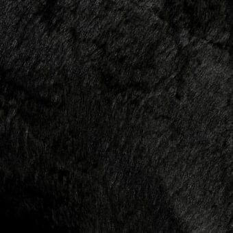Black leather texture sample with dense, shaggy fibers and matte finish; imprinted text reads “mariani > leather > pa – leather atelier > pa cheyenne”.