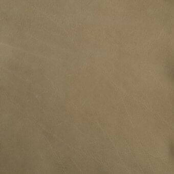 Tan leather texture with a visible grain, mottled surface, and matte finish; features linear creases and a soft, pliable quality from Mariani atelier.