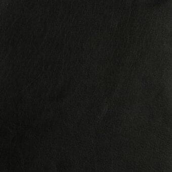Black leather texture with granular surface, fine linear creases, and matte finish; imprinted text reads “mariani > leather > pa – leather atelier > pa torrone”.