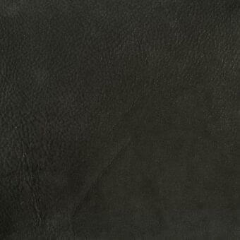 Black leather texture with mottled grain and diagonal seam, matte finish, displaying manufacturer imprint “mariani > leather > pa”.