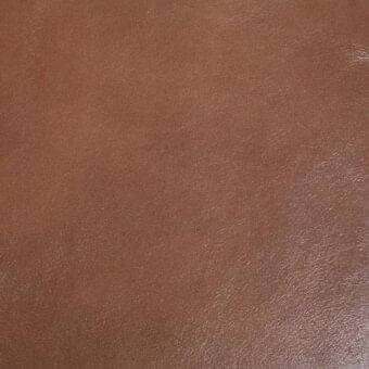 Mariani leather texture sample, medium brown, granular finish with subtle tonal variations and a matte, durable appearance.