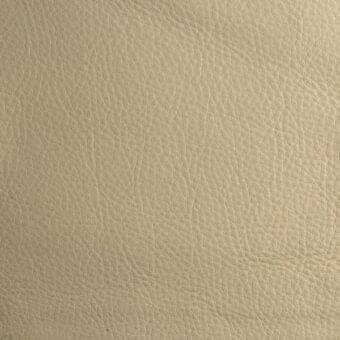 Leather texture sample, light beige with warm undertones, displaying a dense irregular grain and matte finish.