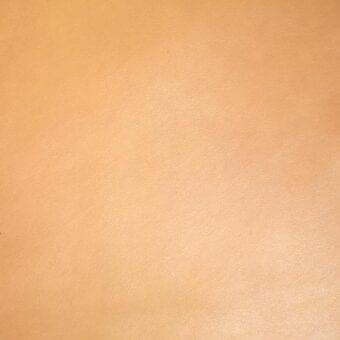 Light tan leather texture sample, “px eucalipto,” shows a granular surface with muted tone variations and a matte finish.