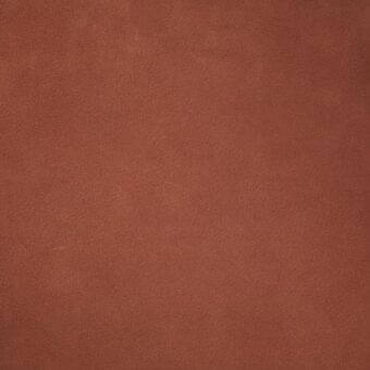 Terracotta leather texture with a matte finish, displaying a granular surface and warm, earthy tone, consistent throughout the frame.