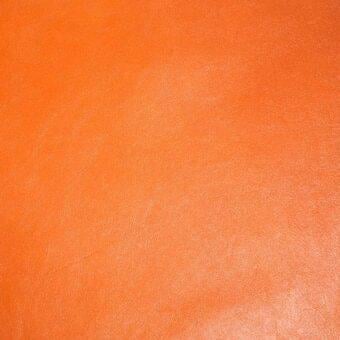 Orange leather texture with a matte finish, displaying a granular surface and subtle tonal variations, suggesting a natural grain and slight wear.