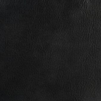 Black leather texture displaying a natural grain pattern with fine creases, matte finish, and subtle tonal variations across a dark background.