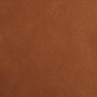 Brown leather texture sample with fine grain, matte finish, and embossed “mariani leather px” text, displaying natural tonal variations.