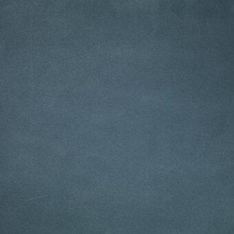 Deep teal leather texture with subtle grain, matte finish, and faint horizontal scratch; Mariani leather sample detail imprinted.