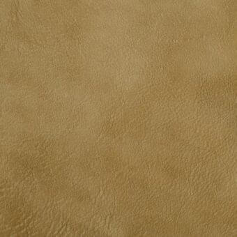 Leather texture sample, golden-brown with woodstock grain, displays matte finish and irregular creases for a naturally aged, pliable appearance.