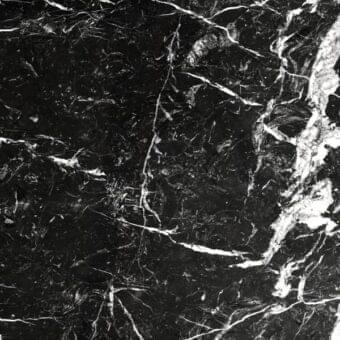 Nero Marquina marble texture displaying black stone with irregular white veins, polished surface, crystalline structure.