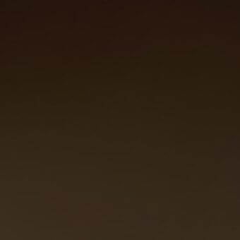 Brown gradient background with smooth texture, displaying a monochromatic palette and uniform tonal shift from dark to light brown shades.