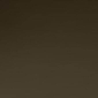 Full-grain saddle leather swatch in dark brown with a subtle gradient, matte finish, and consistent texture; sample displays material quality.