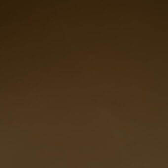 Full-grain saddle leather texture with a gradient brown tonal shift, matte finish, and consistent embossed grain pattern, identified as mariani cf 210.