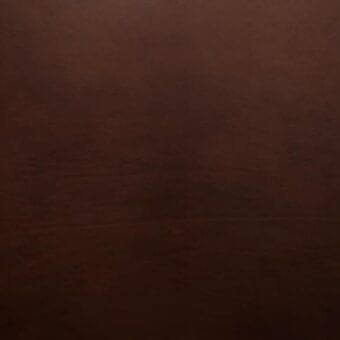 Dark brown Dakota saddle leather texture with gradient, matte finish, and subtle grain; text reads “mariani > saddle leather > cv – vegetable tanned”.