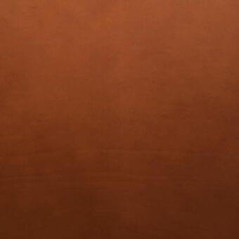 Vegetable tanned saddle leather texture, warm brown gradient, matte finish with grainy surface and irregular markings.