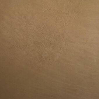 Vegetable-tanned saddle leather texture, tan color, embossed grain pattern with irregular lines and dots, Mariani leather sample detail.