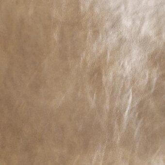 Distressed tan leather texture with mottled pattern, cream to deep tan tones, matte finish, visible grain, and “arketipo > cuoio > cuoio tribe 1030” text.