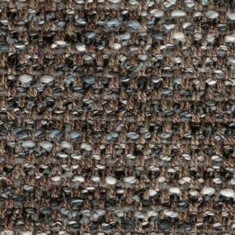 Heathered fabric sample with dark gray, brown, and off-white tones displays a nubby, irregular weave and visible yarn fibers for tactile texture.