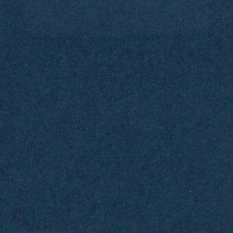 Blue fabric sample displaying a dense woven texture, uniform color, and subtle tonal shifts; text identifies Arketipo fabric, indoor use, elite line.