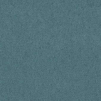 Teal fabric texture displays a granular, matte finish with tonal variations and a slight roughness, showcasing a uniformly colored, woven material.