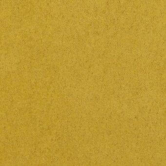 Mustard yellow fabric sample with dense granular texture, matte finish, and woven appearance; Arketipo Elite collection indoor textile.