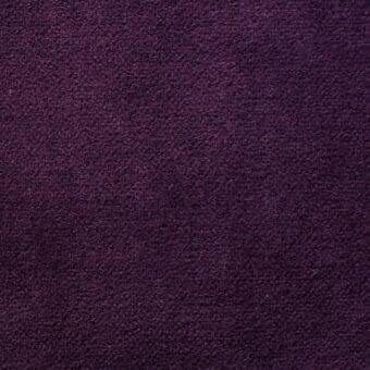 Eggplant purple woven fabric texture with a short pile and matte finish, displaying consistent color and a granular surface detail.