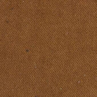 Brown woven fabric texture with diagonal ribs, speckled with dark and silver inclusions, displaying a durable canvas-like material.
