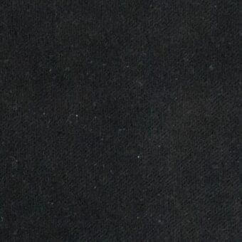 Black woven fabric texture with granular surface, matte finish, and tonal variations; Arketipo sample labeled 110630005530.