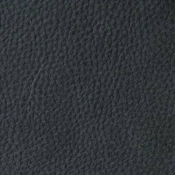 Dark gray pebble grain leather texture sample against white, matte finish, with visible surface bumps and partial label reading “arketipo > leather.”