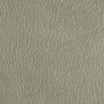 Light gray leather texture with a mottled, pebbled surface and matte finish; subtle brand text imprinted along the bottom edge.