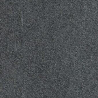 Dark gray leather texture with a dense, uneven grain and matte finish, exhibiting subtle tonal variations across the tightly woven textile surface.