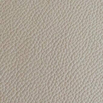 Beige quilted leather texture with pebble-grain pattern, matte finish, and visible “arketipo” label detailing material specifications.