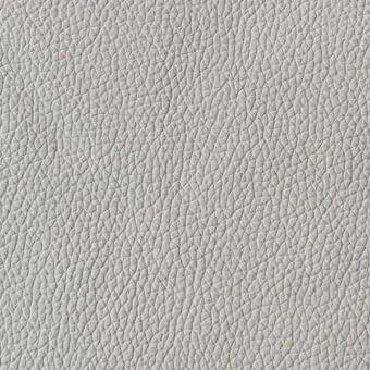 Light gray pebbled leather texture with a dense, repeating pattern and matte finish; sample labeled “arketipo > leather > pelle first > 110030004110”.