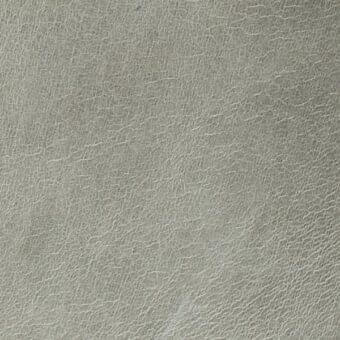 Arketipo leather texture, light gray "pelle leonardo" 110030001001, showing a matte finish with fine creases and natural grain.