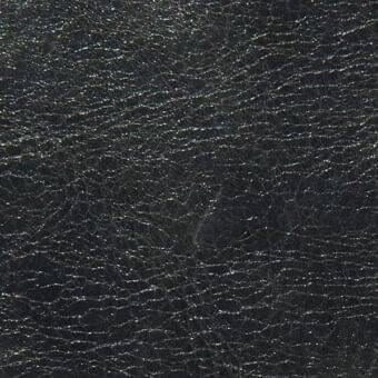 Black leather texture sample, Arketipo pelle leonardo, with a matte finish and irregular raised grain pattern.
