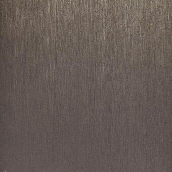 Brushed titanium metal texture with vertical grain, dark gray tone, and matte finish displaying subtle striated patterns under diffused lighting.