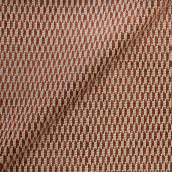 Beige and burnt orange woven fabric sample with a diagonal rectangular pattern, featuring a visible seam and “belmondo” label.