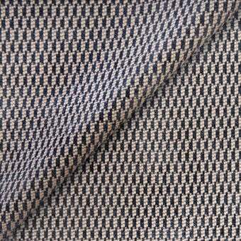 Belmondo fabric swatch, deep blue and beige geometric weave, small square pattern with visible texture and folded structure, studio lighting.