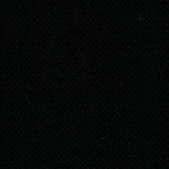 Black woven textile sample with dense, granular texture and embedded small characters forming a random pattern; matte finish.