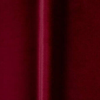 Red satin fabric swatch with vertical seam, displaying a subtle sheen and smooth texture; identified as bellavista o vc 527.