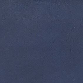 Dark blue leather texture sample with a matte finish and subtle grain, displaying consistent navy color and discreet text identification.