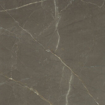 Polished marble texture, dark gray with white veining, displaying a mottled pattern and uneven light reflection from natural fissures.