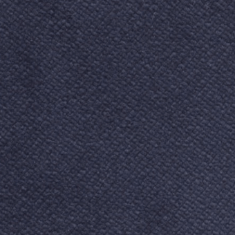 Dark blue velvety fabric texture with a dense, granular nap; studio sample displaying Bizzotto cushion fabric, labeled “b1 – velvety 051”.
